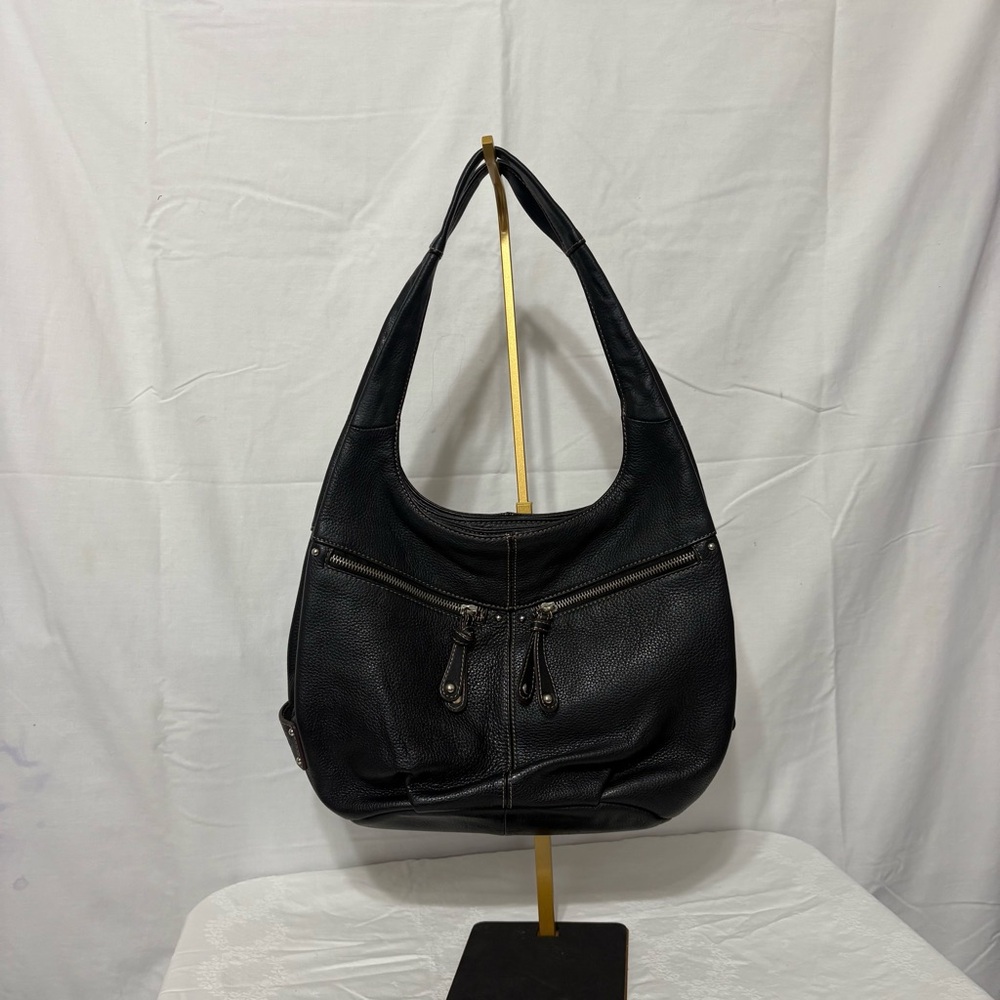 Tignanello black leather hobo shoulder bag with zipper pockets.